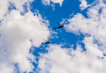 heli copter flight. helicopter transport. helicopter flying in the sky. two helicopter rotorcraft. police helicopter. Flying heli copter