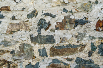Background texture of the stone wall of the old building. Background stone wall
