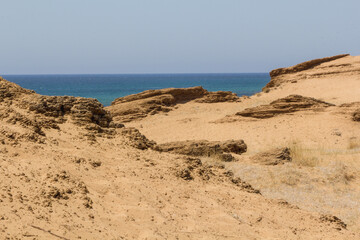 The beach of Issos in Corfu (Greece) has beautiful sand dunes and it's a good spot to practice water sports like windsurf. The island of Kerkira is the Ionic Sea, an area of the Mediterranean