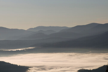 
fog over the carpathian mountains in autumn