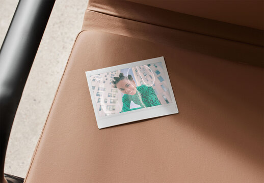 Mockup of customizable instant camera photo print available with different effects, on chair