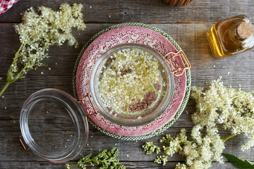 Meadowsweet tincture in a glass jar, top view