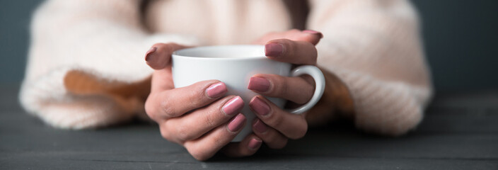 woman hand cup of coffee