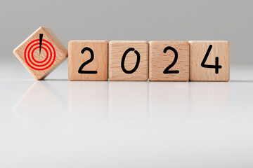 2024 Happy New Year with wooden Home model on table office. New House, Financial, Property...