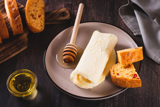 Turkish kaymak clotted cream butter with honey on a plate