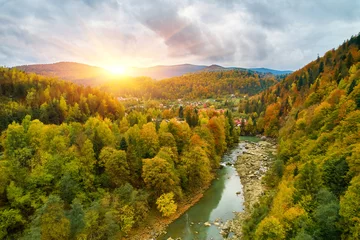 Foto op Aluminium aerial bird's-eye view of colorful forest, blue river and rocks. Drone shot. natural autumn landscape © Ryzhkov Oleksandr