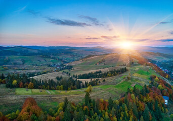 Sunset over the mountains in the Carpathians. Aerial drone view.