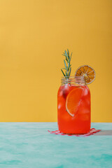 fresh summer bright coloured drink on a yellow background