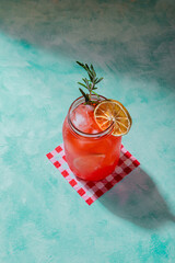 hard lighted jar of red refreshing summer cocktail