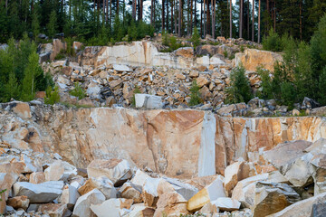 View of a crumbling rock, stones fall from a cliff, sandy cliffs