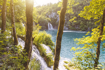 Beautiful autumn landscape. View of the waterfall in autumn. Waterfall in autumn colors. Plitvice lakes, Croatia