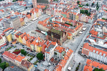 The central square of the city of Wroclaw, an ancient European city with ancient architecture, a popular tourist place, the red roofs of the old town, Poland