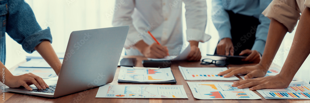 Fototapete Panorama shot analyst team utilizing BI Fintech to analyze financial report with laptop. Businesspeople analyzing BI power dashboard displayed on laptop screen for business insight. Scrutinize
