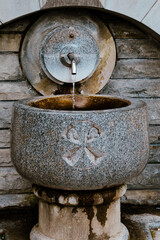 Water flowing from a spring through a tap. Religious place
- 634476976