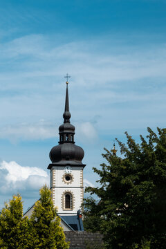 The tower of the church against the sky