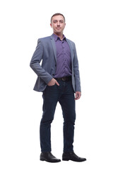 Full length portrait of a young businessman standing with his hands in the pockets.
