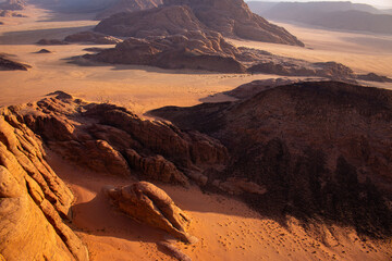 Rock formations of Wadi Rum Desert, the view from a hot air balloon at sunrise, April, Jordan
