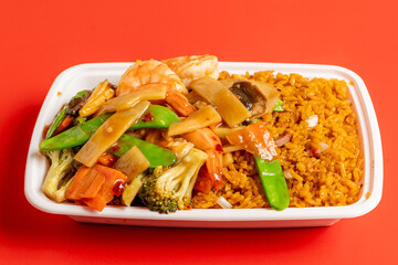 Fried shrimp and vegetables over rice