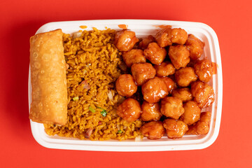 Orange chicken with fried rice and egg roll