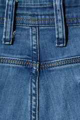Fototapeta premium Back view of blue classic jeans, belt