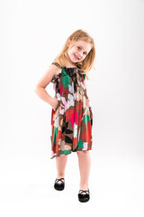 Little girl posing on a light background