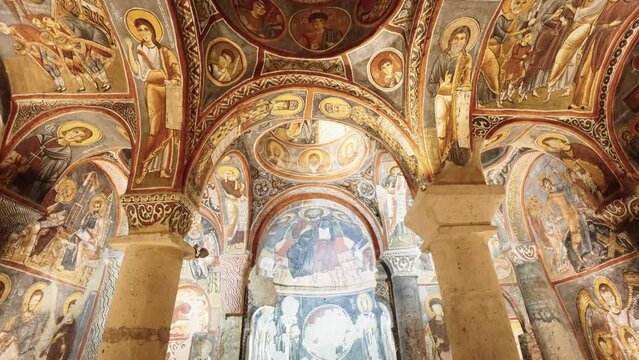 The interior of  the Dark Church or Yılanlı Kilise in Cappadocia ancient cave building in Turkey. Historical cave church.
