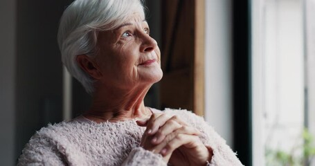 Senior woman, face and thinking by window in retirement for hope, dream or faith at old age home. Lonely elderly female person in wonder, decision or choice looking out glass at life, idea or support