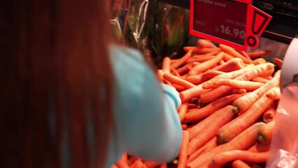 buys carrots in the supermarket