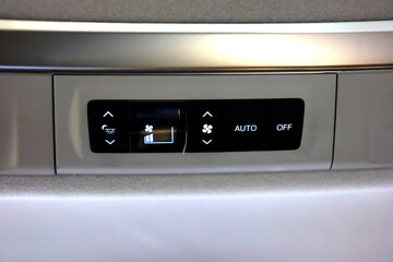 AC button on ceiling of luxury car for rear passengers in big SUV car. car air conditioner with three zone system