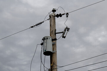 Street utility pole with distribution transformer