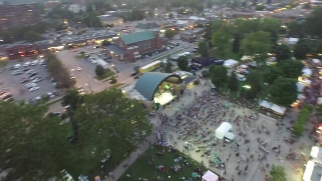 Turn Then Pan Over Crowds At Night In Bandshell Concert Aerial