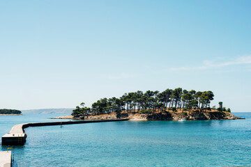 Small rocky island on the Rajska beach on the Rab island in Croatia