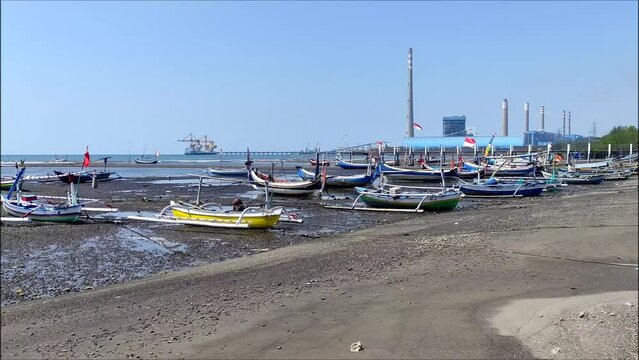 north coast of java which is used as a berth for wooden fishing boats close to the Paiton steam power plant, Probolinggo, East Java, Indonesia