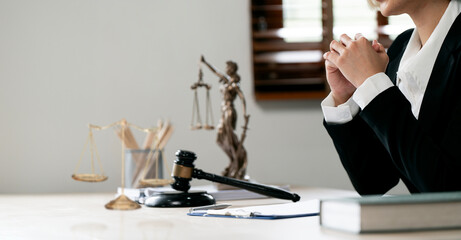 Female lawyer sitting at her desk office.