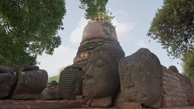 Buddhist Head Statues in Historic Ancient Ruins of Ayutthaya, Thailand. 4K 60FPS