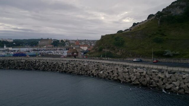 Rising Establishing Drone Shot Over Scarborough Harbour and Seaside Town on Overcast Morning