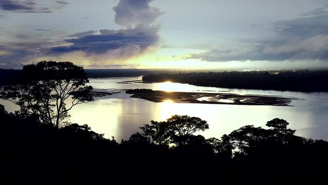 The Rio Napo River in the Ecuadorian Amazon during evening ambiance.