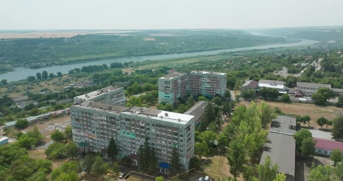 soviet-style building on top of a hill in the city of rezina with a view of the Dnieper river roundabout by drone in Moldova of Republic