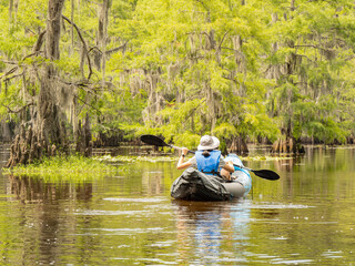 People playing boat in Caddo Lake State Park