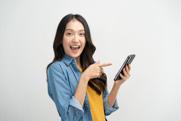 Happy Asian woman holding a smartphone and winning the prize.