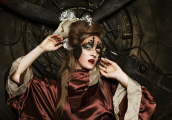 Aggressive stylish steampunk lady in a creative interior.