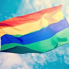 LGBT pride flag and blue sky background