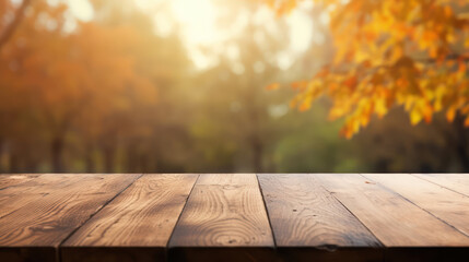 Naklejka na ściany i meble Wooden table top with blur background of autumn
