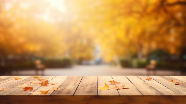Wooden table top with blur background of autumn
