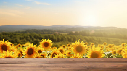 Wooden table top with blur background of sunflower field