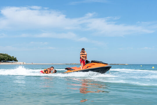 Lifeguard driving a Jet ski on duty on the sea