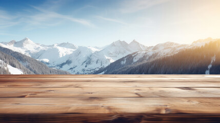 Empty wooden table top with blur background of snow capped mountains