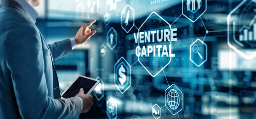 Businessman touching finger Venture Capital. Mixed Media