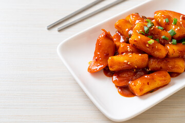 Korean rice cake stick with sausage in spicy sauce - Tteokbokki