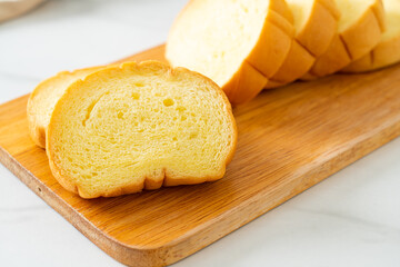 potatoes bread sliced on wood board
